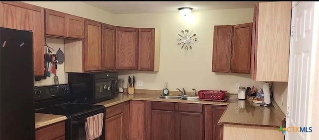 kitchen featuring black appliances and sink