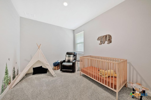 123 Paul Pena Dr, San Marcos, TX 78666 - carpeted bedroom with a nursery area and baseboards