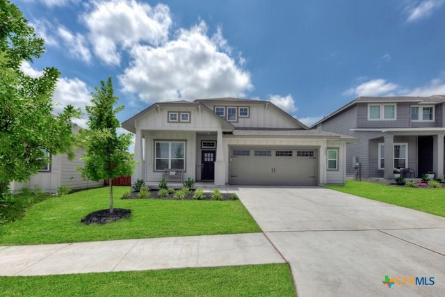 123 Paul Pena Dr, San Marcos, TX 78666 - craftsman inspired home featuring a garage, board and batten siding, concrete driveway, a front yard, and covered porch