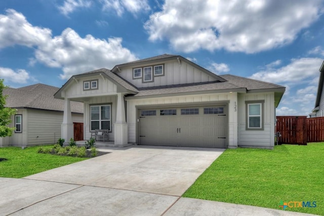 123 Paul Pena Dr, San Marcos, TX 78666 - craftsman-style home with board and batten siding, a garage, covered porch, roof with shingles, and driveway