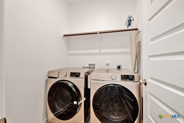 123 Paul Pena Dr, San Marcos, TX 78666 - washroom featuring washer and clothes dryer