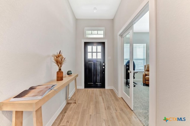 123 Paul Pena Dr, San Marcos, TX 78666 - entryway featuring light wood-style floors and baseboards