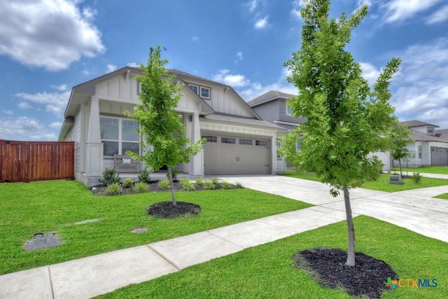 123 Paul Pena Dr, San Marcos, TX 78666 - view of front facade featuring board and batten siding, concrete driveway, a garage, and covered porch
