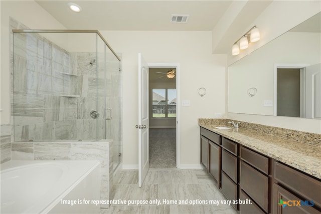 bathroom with shower with separate bathtub and vanity