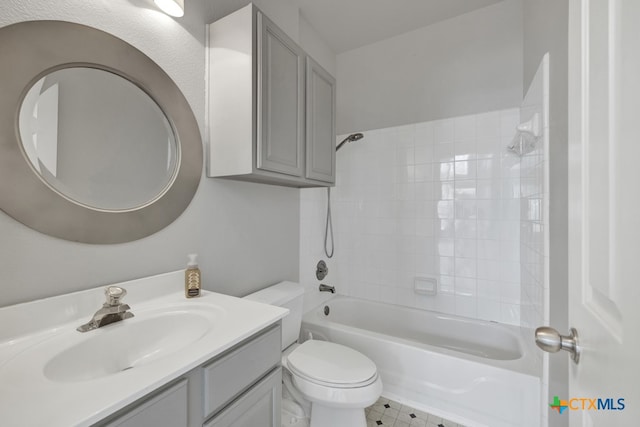 full bathroom with tiled shower / bath combo, vanity, and toilet