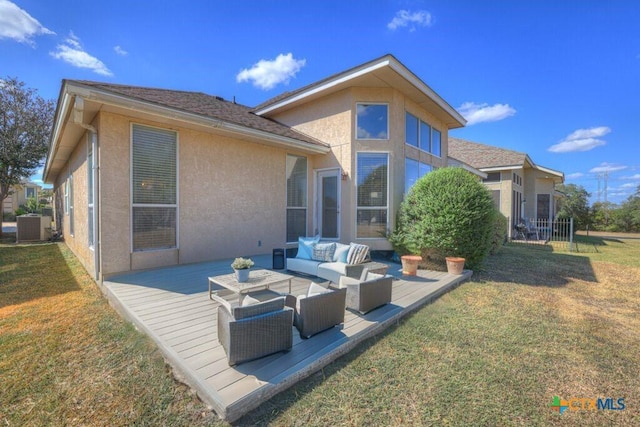 back of property with cooling unit, outdoor lounge area, a deck, and a lawn