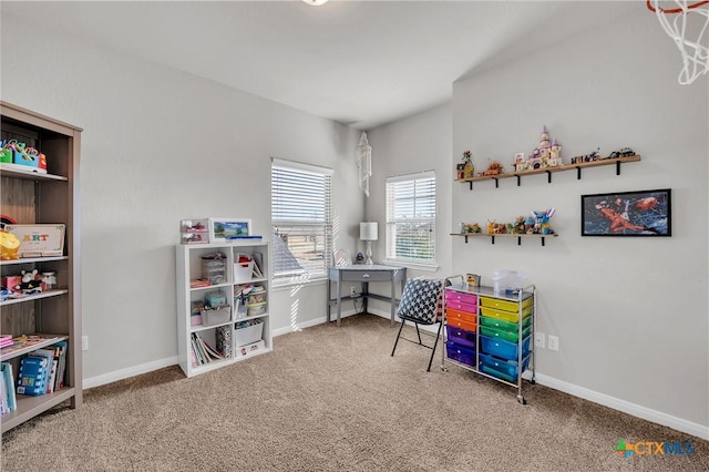 rec room with carpet flooring and baseboards