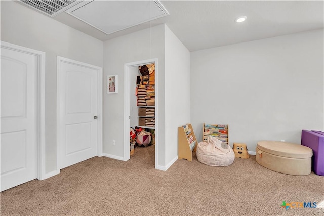 recreation room featuring visible vents, baseboards, attic access, carpet flooring, and recessed lighting