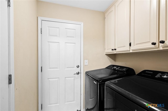 308 Green Gable Dr, Victoria, TX 77904 - laundry room with washer and clothes dryer and cabinet space
