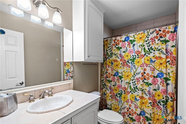 308 Green Gable Dr, Victoria, TX 77904 - bathroom with vanity, toilet, and a shower with shower curtain