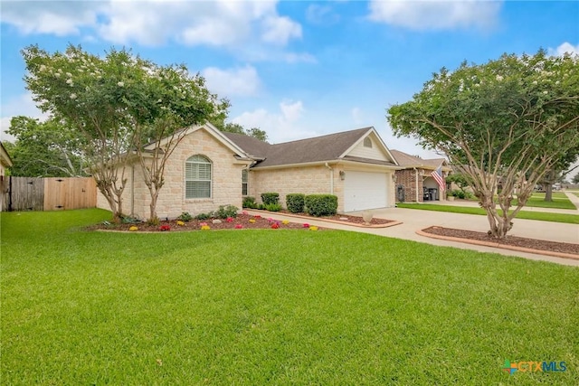 308 Green Gable Dr, Victoria, TX 77904 - ranch-style home with concrete driveway, an attached garage, and stone siding