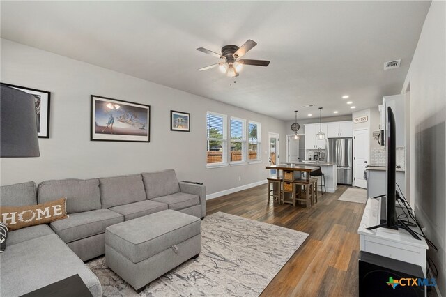 964 Allende St, Seguin, TX 78155 - living room with ceiling fan, dark wood-style floors, recessed lighting, and baseboards
