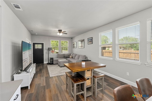 964 Allende St, Seguin, TX 78155 - living room featuring ceiling fan, baseboards, and dark wood finished floors
