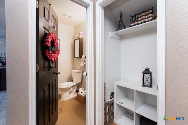 bathroom featuring toilet