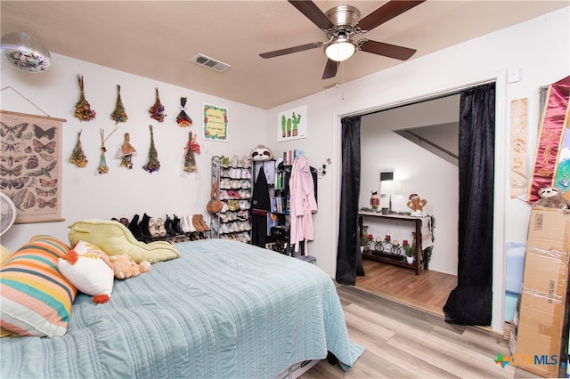 bedroom featuring ceiling fan and light wood-type flooring