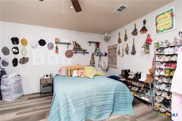 bedroom featuring ceiling fan and light hardwood / wood-style flooring