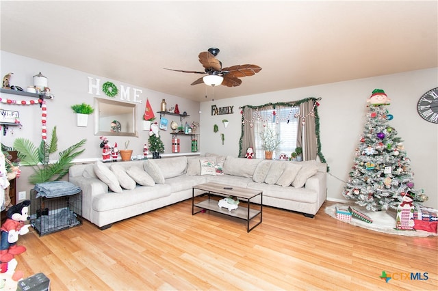 living room featuring hardwood / wood-style flooring and ceiling fan