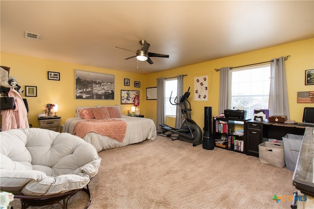 carpeted bedroom with ceiling fan