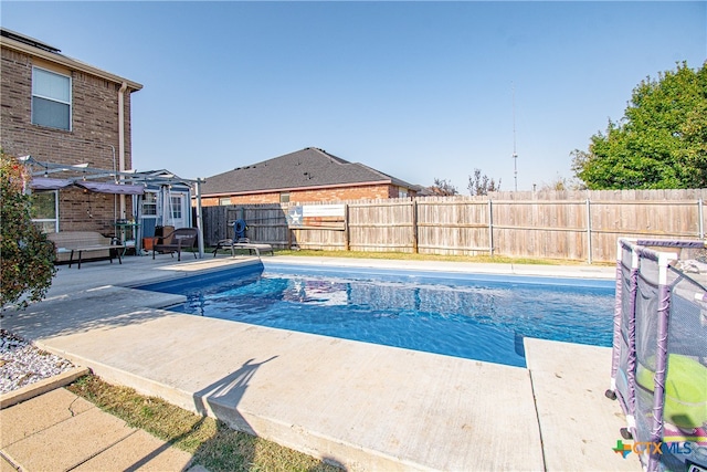 view of swimming pool with a pergola and a patio area