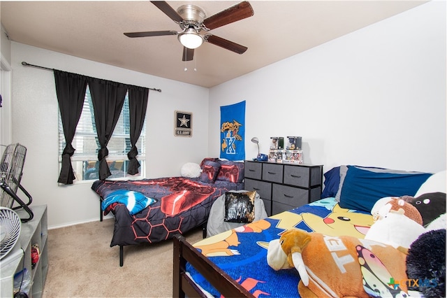 bedroom featuring ceiling fan and light carpet