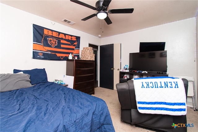 bedroom with ceiling fan and light colored carpet