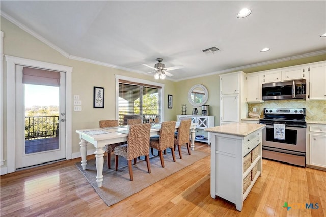 kitchen with light wood-type flooring, visible vents, a wealth of natural light, and stainless steel appliances