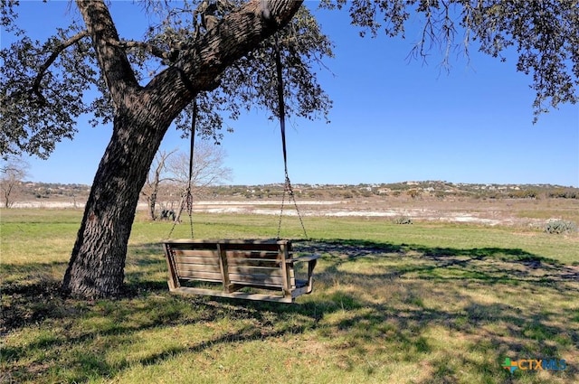 view of property's community with a lawn