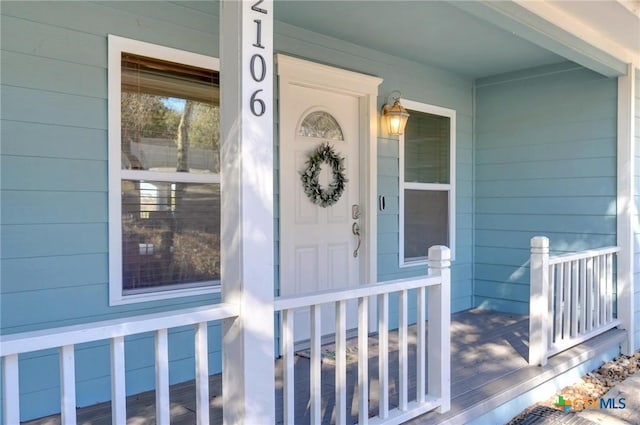 property entrance with covered porch