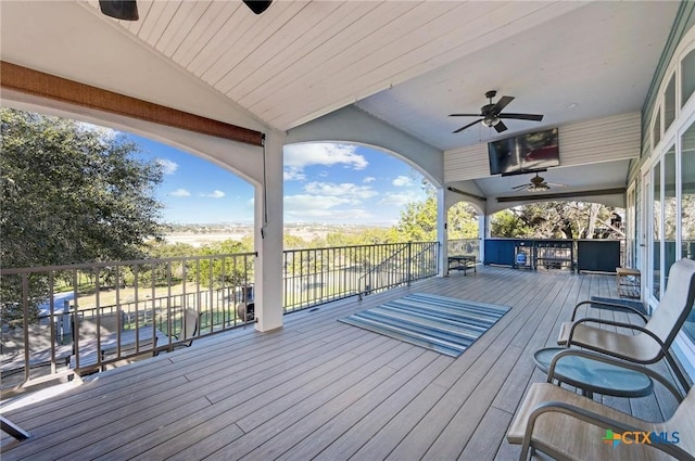 wooden deck with ceiling fan