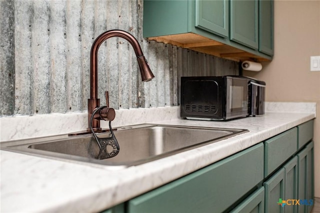2102 Leon Dr, Port Lavaca, TX 77979 - kitchen view of green cabinetry and light countertops