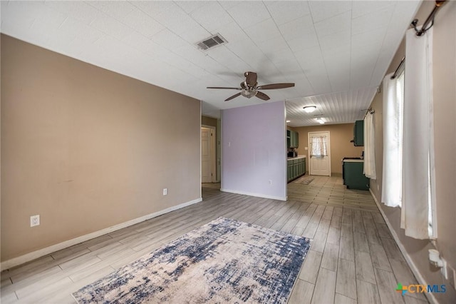 2102 Leon Dr, Port Lavaca, TX 77979 - unfurnished living room featuring a ceiling fan and wood finished floors