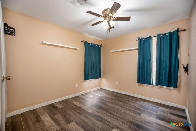 2102 Leon Dr, Port Lavaca, TX 77979 - empty room featuring dark wood finished floors and a ceiling fan