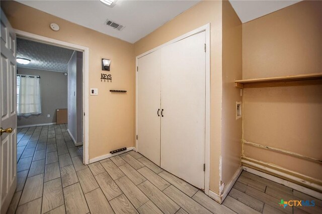 2102 Leon Dr, Port Lavaca, TX 77979 - corridor with wood tiled floors and baseboards