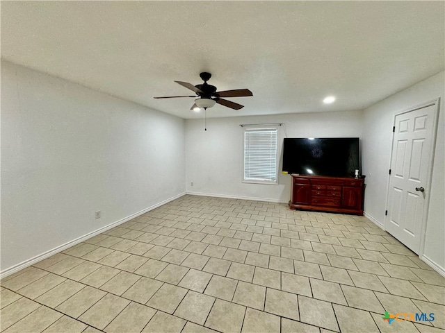 unfurnished living room featuring ceiling fan