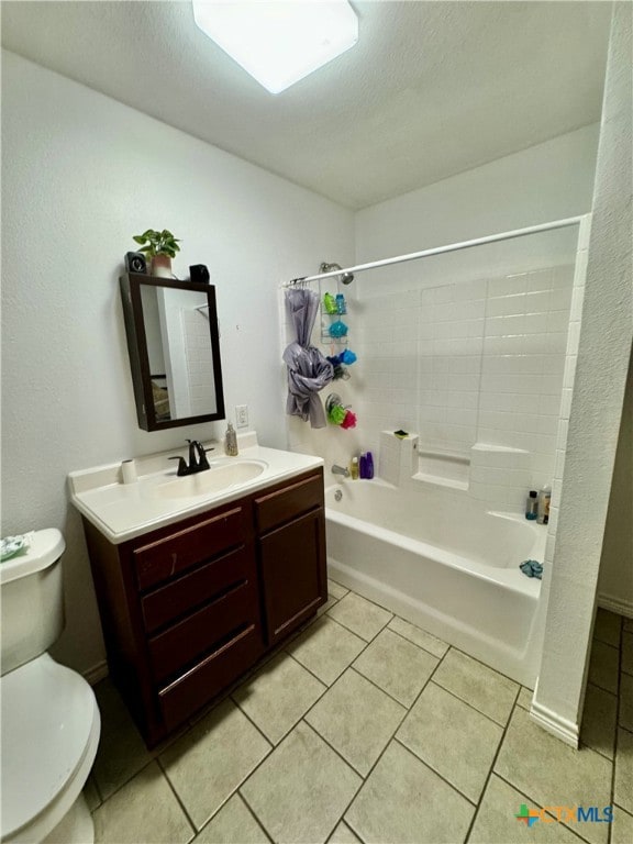 full bathroom with toilet, vanity, tile patterned flooring, and shower / washtub combination