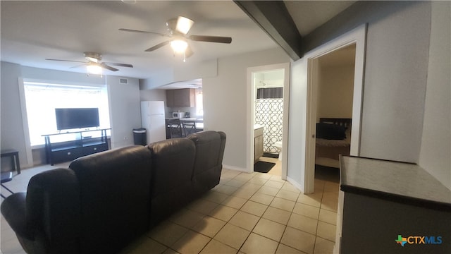 tiled living room featuring ceiling fan