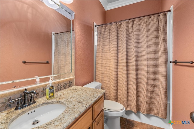 bathroom with tile patterned floors, a textured wall, toilet, vanity, and ornamental molding