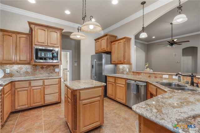 kitchen with backsplash, a ceiling fan, ornamental molding, a sink, and appliances with stainless steel finishes