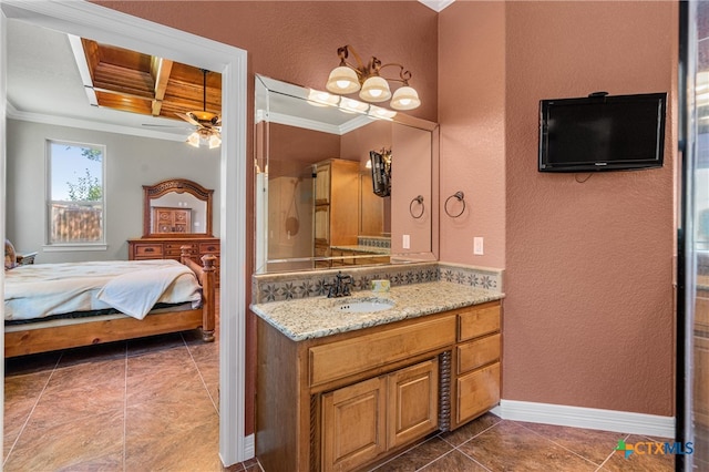 bathroom featuring a textured wall, crown molding, and ensuite bathroom