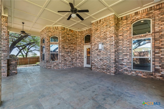 view of patio / terrace featuring fence and a ceiling fan