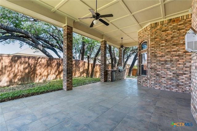 view of patio / terrace with ceiling fan and fence