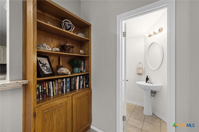 25039 Arrow Gln, San Antonio, TX 78258 - bathroom featuring tile patterned flooring and baseboards