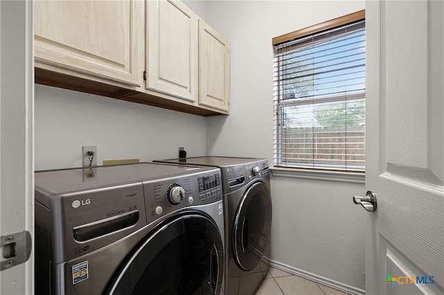 25039 Arrow Gln, San Antonio, TX 78258 - laundry area featuring cabinet space, independent washer and dryer, light tile patterned floors, and baseboards