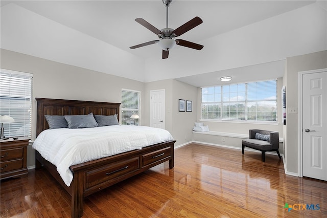 25039 Arrow Gln, San Antonio, TX 78258 - bedroom featuring wood finished floors, vaulted ceiling, baseboards, and a ceiling fan