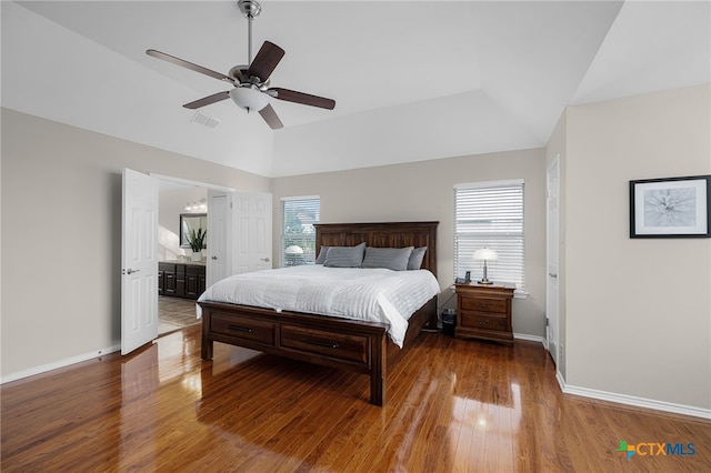 25039 Arrow Gln, San Antonio, TX 78258 - bedroom with baseboards, wood finished floors, lofted ceiling, a ceiling fan, and connected bathroom
