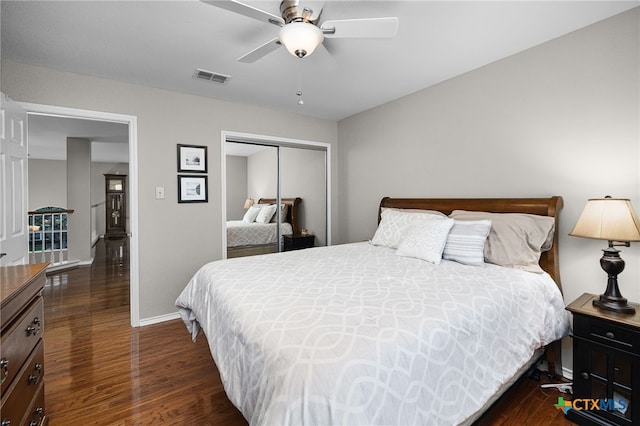 25039 Arrow Gln, San Antonio, TX 78258 - bedroom featuring a closet, dark wood-type flooring, baseboards, and a ceiling fan