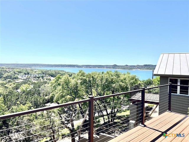 balcony featuring a water view