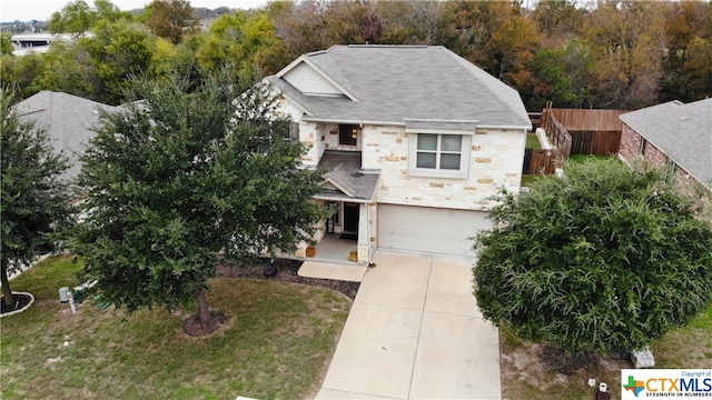 view of front facade featuring a garage and a front yard