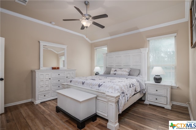 bedroom featuring dark hardwood / wood-style flooring, ceiling fan, and crown molding