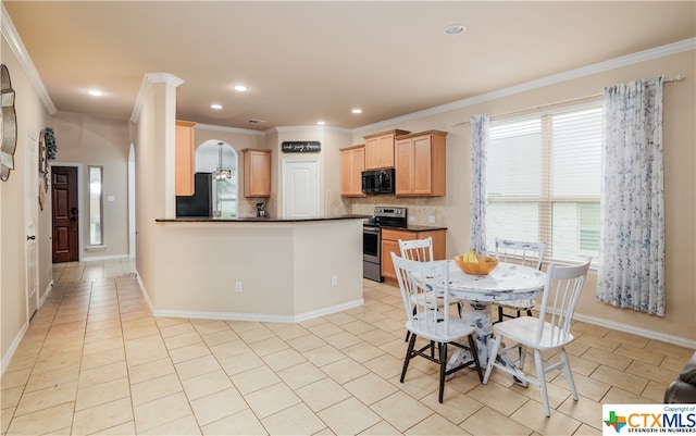 kitchen with backsplash, light tile patterned flooring, black appliances, and crown molding